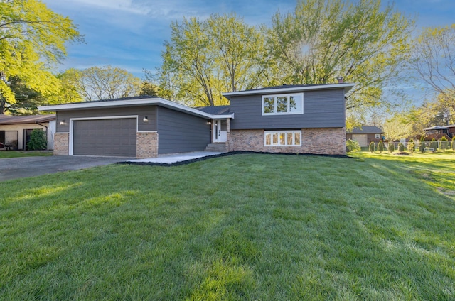 8464 Greenwood Dr, Mounds View, MN 55112 - split level home with an attached garage, asphalt driveway, and brick siding