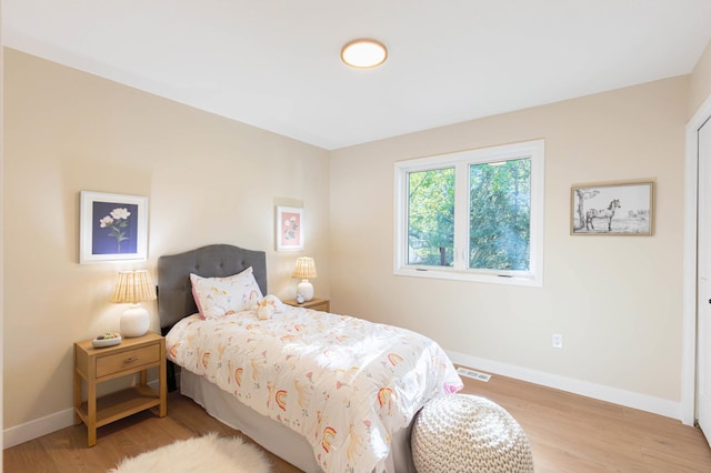 8464 Greenwood Dr, Mounds View, MN 55112 - bedroom with baseboards and wood finished floors