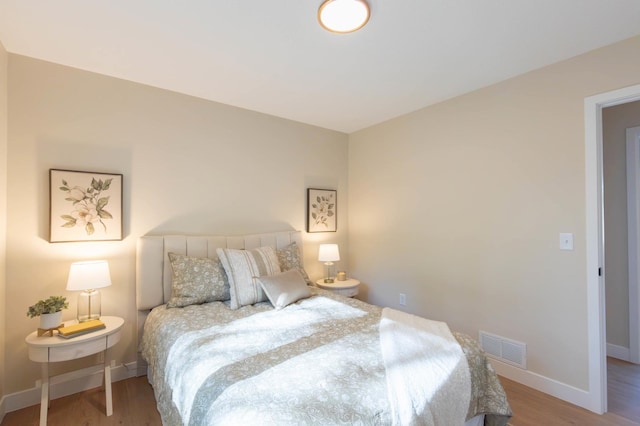 8464 Greenwood Dr, Mounds View, MN 55112 - bedroom with wood finished floors and baseboards