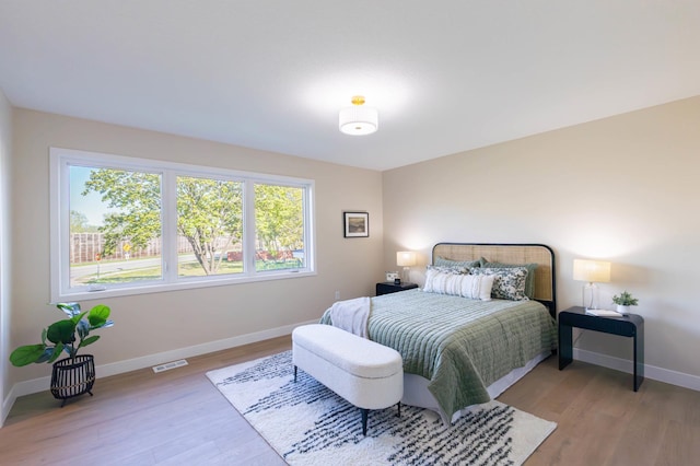 8464 Greenwood Dr, Mounds View, MN 55112 - bedroom featuring light wood-style floors and baseboards