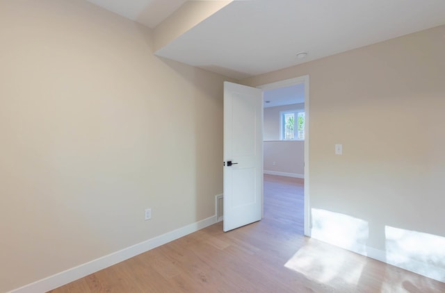 8464 Greenwood Dr, Mounds View, MN 55112 - spare room featuring light wood-type flooring and baseboards