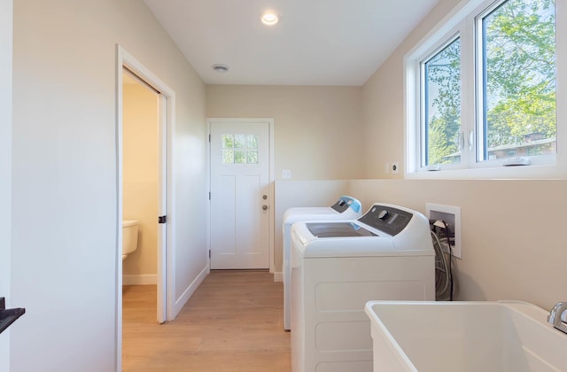 8464 Greenwood Dr, Mounds View, MN 55112 - laundry area with light wood-style flooring, washing machine and dryer, baseboards, and recessed lighting