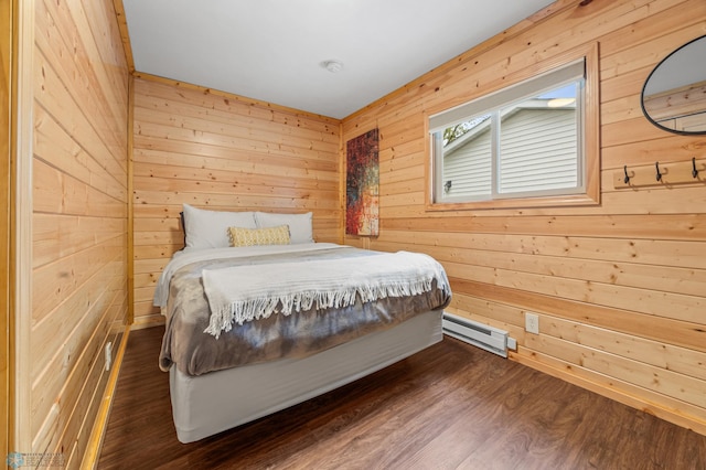 24527 Twilight Ln, Lida Twp, MN 56572 - bedroom featuring a baseboard radiator, wooden walls, and dark wood-type flooring