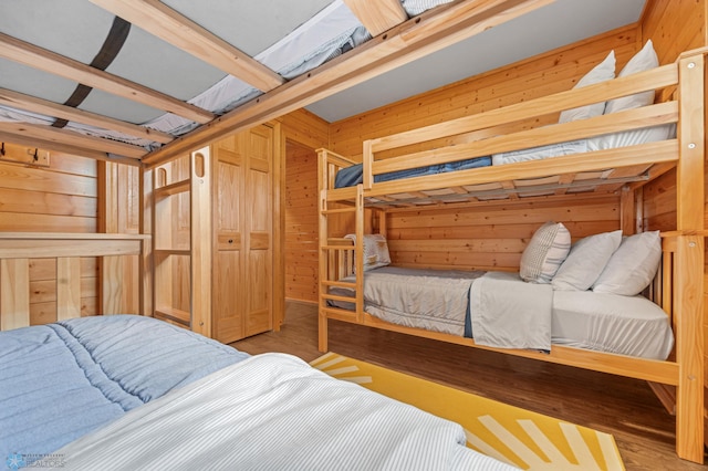 24527 Twilight Ln, Lida Twp, MN 56572 - bedroom with wooden walls and wood finished floors