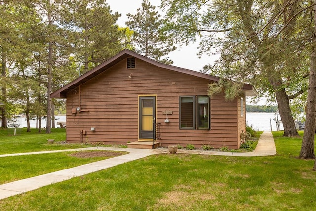 6769 County Road 13, Lake Edward Twp, MN 56468 - view of front of home with a front yard and a water view