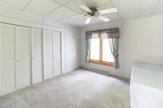6769 County Road 13, Lake Edward Twp, MN 56468 - unfurnished bedroom featuring light colored carpet, a ceiling fan, and two closets