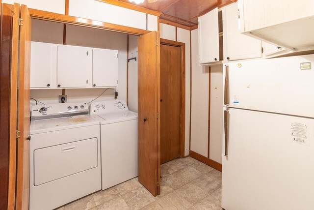 6769 County Road 13, Lake Edward Twp, MN 56468 - laundry area featuring cabinet space and washing machine and clothes dryer