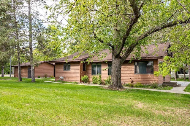 6769 County Road 13, Lake Edward Twp, MN 56468 - view of front facade featuring a front lawn and a shingled roof
