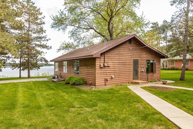 6769 County Road 13, Lake Edward Twp, MN 56468 - view of front of house with a front lawn and a water view