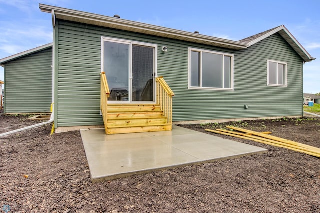 1474 66th Ave S, Fargo, ND 58104 - rear view of property featuring entry steps and a patio area