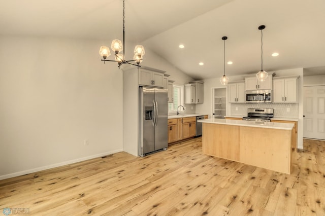 1474 66th Ave S, Fargo, ND 58104 - kitchen featuring appliances with stainless steel finishes, a sink, light countertops, backsplash, and recessed lighting