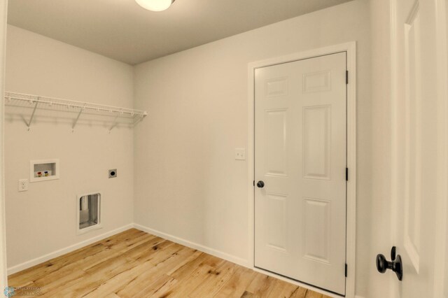 1474 66th Ave S, Fargo, ND 58104 - laundry area with electric dryer hookup, washer hookup, light wood-type flooring, and baseboards
