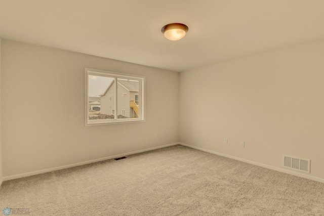 1474 66th Ave S, Fargo, ND 58104 - carpeted empty room with baseboards