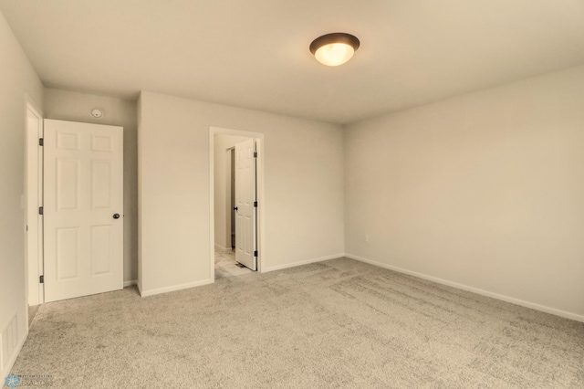 1474 66th Ave S, Fargo, ND 58104 - unfurnished bedroom with carpet and baseboards