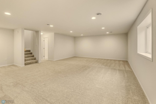 1474 66th Ave S, Fargo, ND 58104 - finished basement with light colored carpet, stairway, recessed lighting, and baseboards