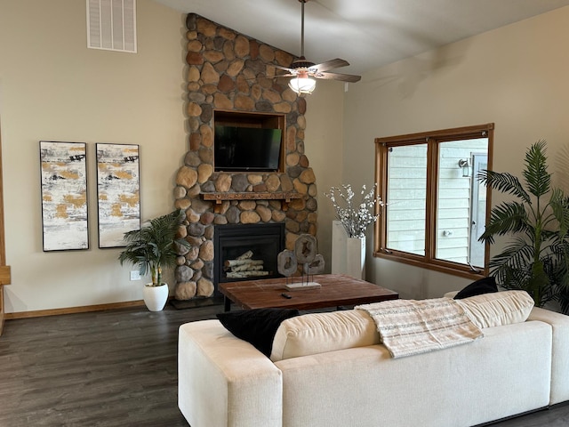 50429 245th Ave, Staples Twp, MN 56479 - living room featuring a fireplace, dark wood-style floors, ceiling fan, baseboards, and vaulted ceiling