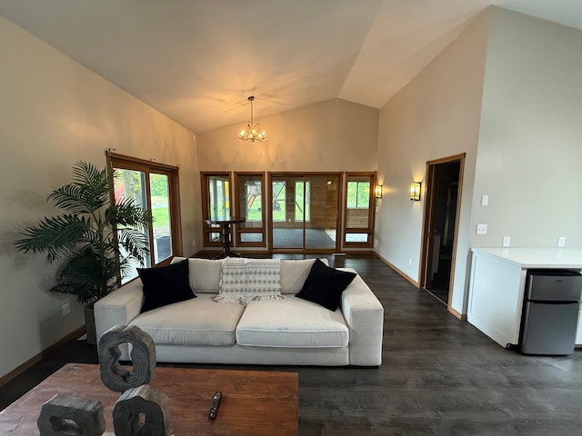 50429 245th Ave, Staples Twp, MN 56479 - living room featuring a chandelier, dark wood-style floors, baseboards, and high vaulted ceiling