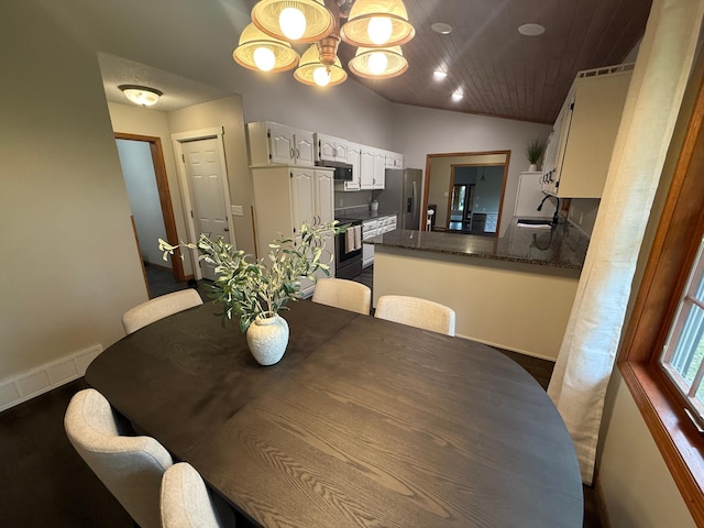 50429 245th Ave, Staples Twp, MN 56479 - dining space featuring a chandelier, baseboards, wood ceiling, vaulted ceiling, and dark wood-style flooring