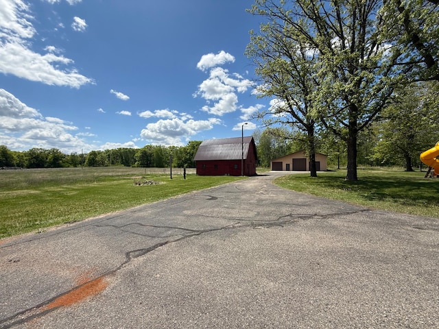 50429 245th Ave, Staples Twp, MN 56479 - view of asphalt driveway featuring a barn