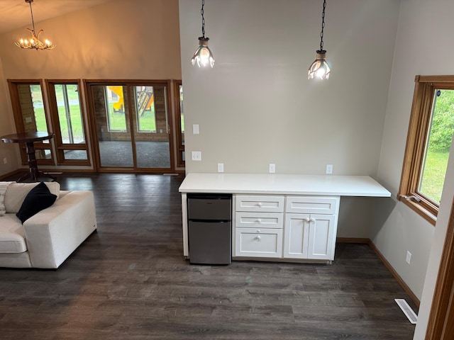 50429 245th Ave, Staples Twp, MN 56479 - kitchen featuring freestanding refrigerator, high vaulted ceiling, dark wood-style floors, open floor plan, and white cabinetry