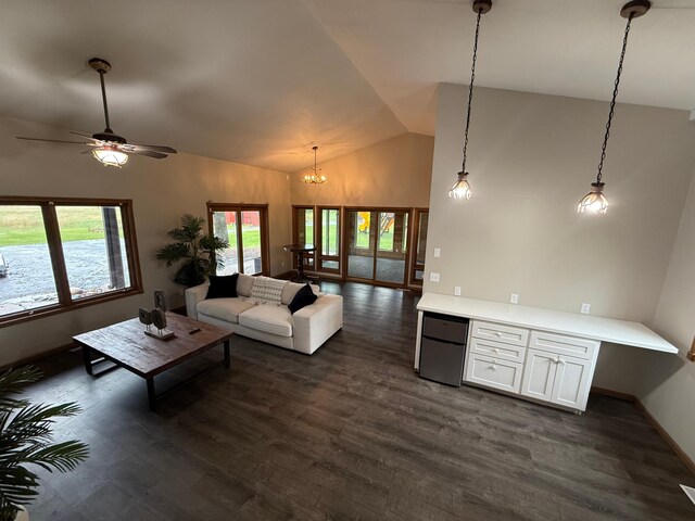 50429 245th Ave, Staples Twp, MN 56479 - living area with vaulted ceiling, dark wood-style flooring, a chandelier, and baseboards