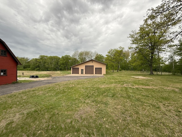50429 245th Ave, Staples Twp, MN 56479 - view of grassy yard featuring a detached garage and an outdoor structure