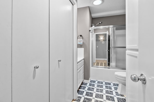 216 Crestview Cir, Jordan, MN 55352 - bathroom with toilet, enclosed tub / shower combo, a textured ceiling, and vanity