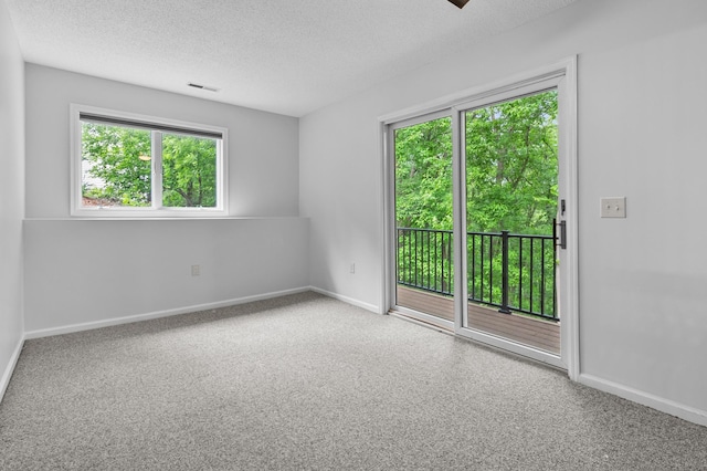 216 Crestview Cir, Jordan, MN 55352 - spare room featuring a textured ceiling and baseboards