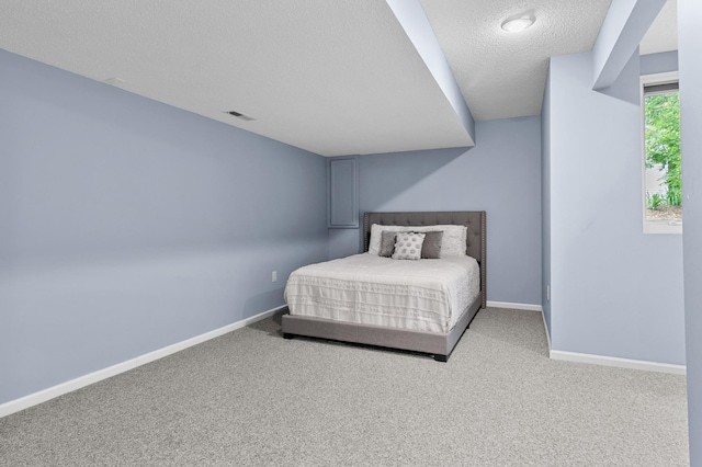 216 Crestview Cir, Jordan, MN 55352 - bedroom featuring a textured ceiling, carpet floors, and baseboards