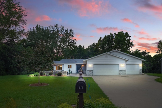 216 Crestview Cir, Jordan, MN 55352 - ranch-style house with driveway, a yard, and a garage