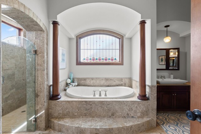1595 River Shore Dr, Hastings, MN 55033 - bathroom featuring ornate columns, a bath, vanity, and a shower stall