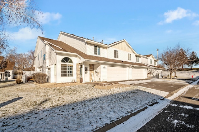 12828 43rd St NE, Saint Michael, MN 55376 - rear view of house featuring a garage and concrete driveway