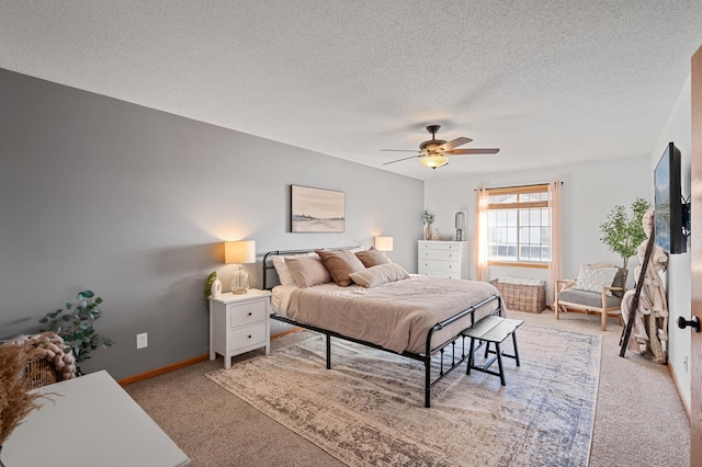 12828 43rd St NE, Saint Michael, MN 55376 - bedroom featuring light carpet, a textured ceiling, a ceiling fan, and baseboards