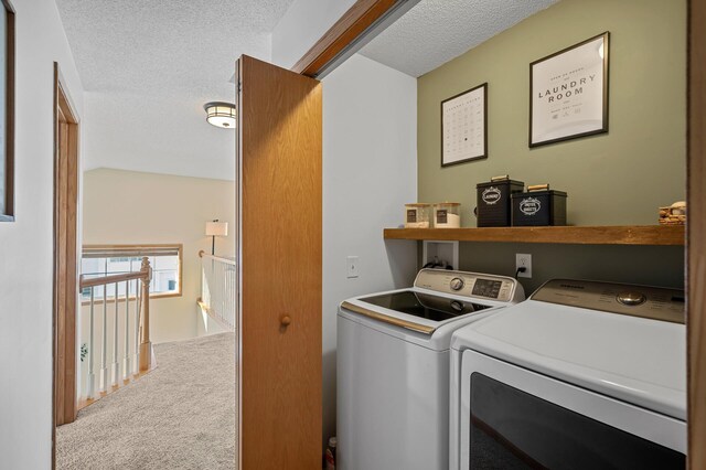 12828 43rd St NE, Saint Michael, MN 55376 - laundry room featuring washing machine and clothes dryer, carpet flooring, and a textured ceiling