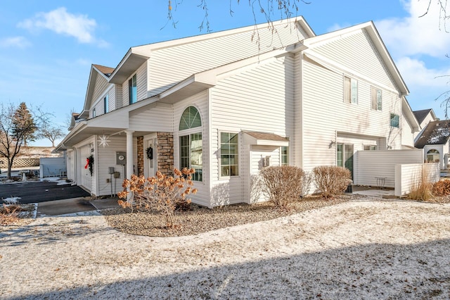 12828 43rd St NE, Saint Michael, MN 55376 - view of home's exterior with a porch and asphalt driveway