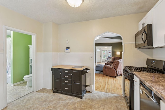 2005 Nokomis Ave, Saint Paul, MN 55119 - kitchen featuring black appliances, arched walkways, white cabinetry, a textured ceiling, and baseboard heating