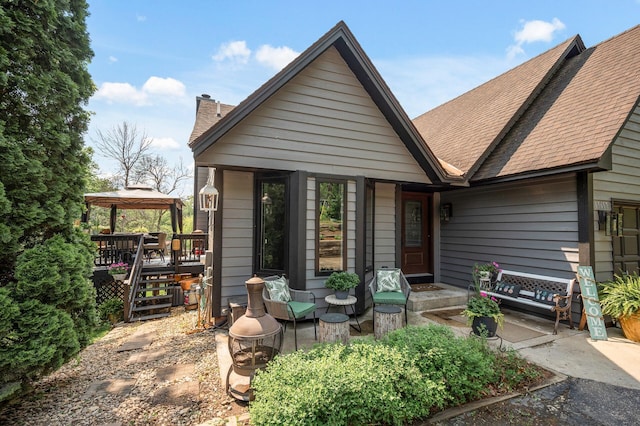 15657 Fish Point Rd SE, Prior Lake, MN 55372 - view of front of property with a gazebo, a shingled roof, and a chimney