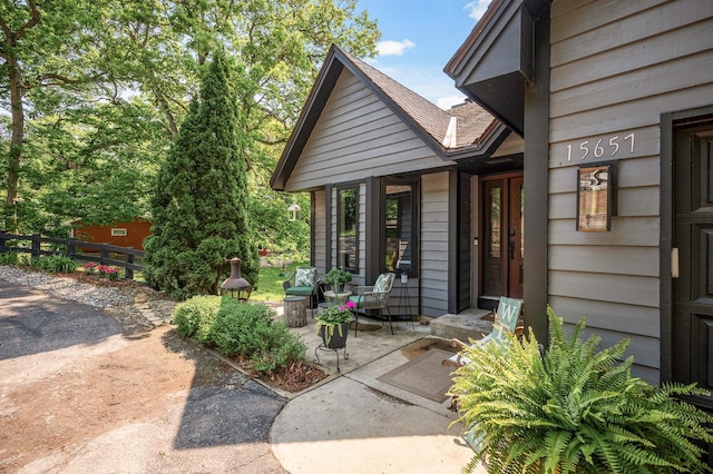 15657 Fish Point Rd SE, Prior Lake, MN 55372 - property entrance with a shingled roof