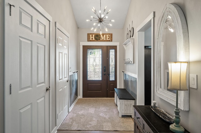 15657 Fish Point Rd SE, Prior Lake, MN 55372 - entrance foyer featuring a chandelier, light carpet, and vaulted ceiling