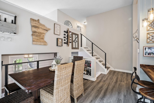 15657 Fish Point Rd SE, Prior Lake, MN 55372 - dining room featuring wood finished floors, a chandelier, baseboards, and stairs