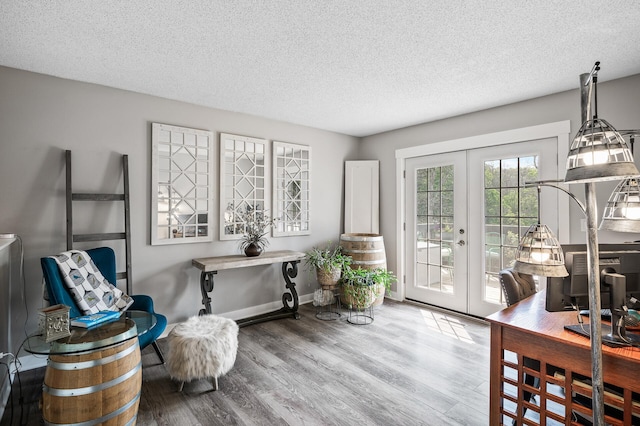15657 Fish Point Rd SE, Prior Lake, MN 55372 - living area featuring french doors, a textured ceiling, wood finished floors, and baseboards