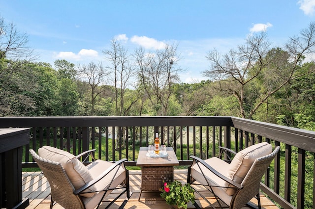 15657 Fish Point Rd SE, Prior Lake, MN 55372 - wooden deck featuring a wooded view