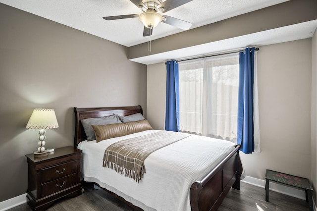 15657 Fish Point Rd SE, Prior Lake, MN 55372 - bedroom with baseboards, dark wood-type flooring, and a ceiling fan