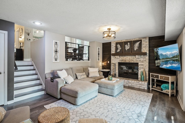15657 Fish Point Rd SE, Prior Lake, MN 55372 - living room featuring a textured ceiling, wood finished floors, a fireplace, and stairs
