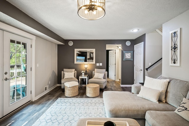 15657 Fish Point Rd SE, Prior Lake, MN 55372 - living area with dark wood-type flooring, a textured ceiling, baseboards, and a chandelier