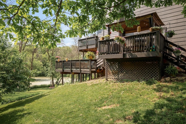 15657 Fish Point Rd SE, Prior Lake, MN 55372 - view of green lawn with stairway and a wooden deck
