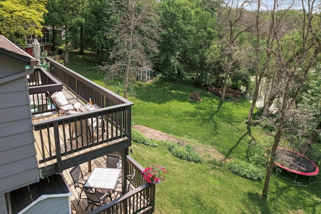 15657 Fish Point Rd SE, Prior Lake, MN 55372 - view of green lawn with a wooden deck and outdoor dining area