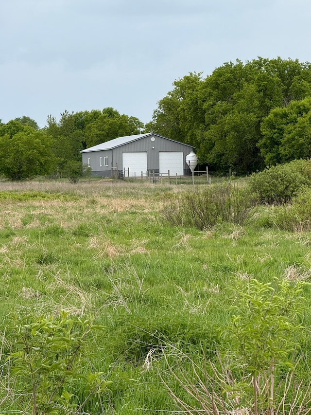 25809 Virgo St NE, Oxford Twp, MN 55079 - view of yard featuring a detached garage and an outdoor structure