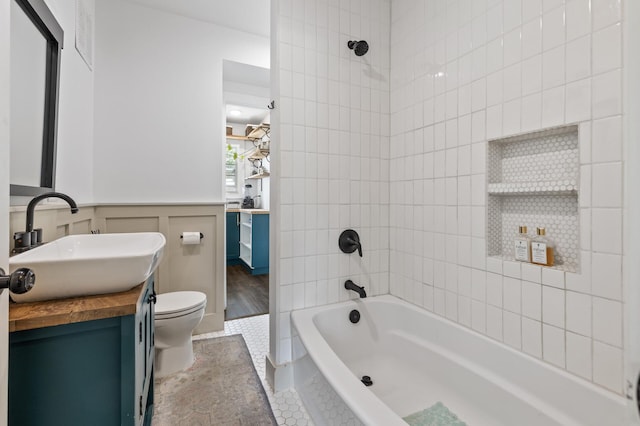 7537 Wentworth Ave, Richfield, MN 55423 - bathroom featuring vanity, toilet,  shower combination, and tile patterned floors