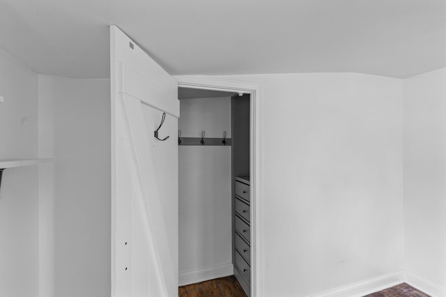 7537 Wentworth Ave, Richfield, MN 55423 - walk in closet with dark wood-type flooring